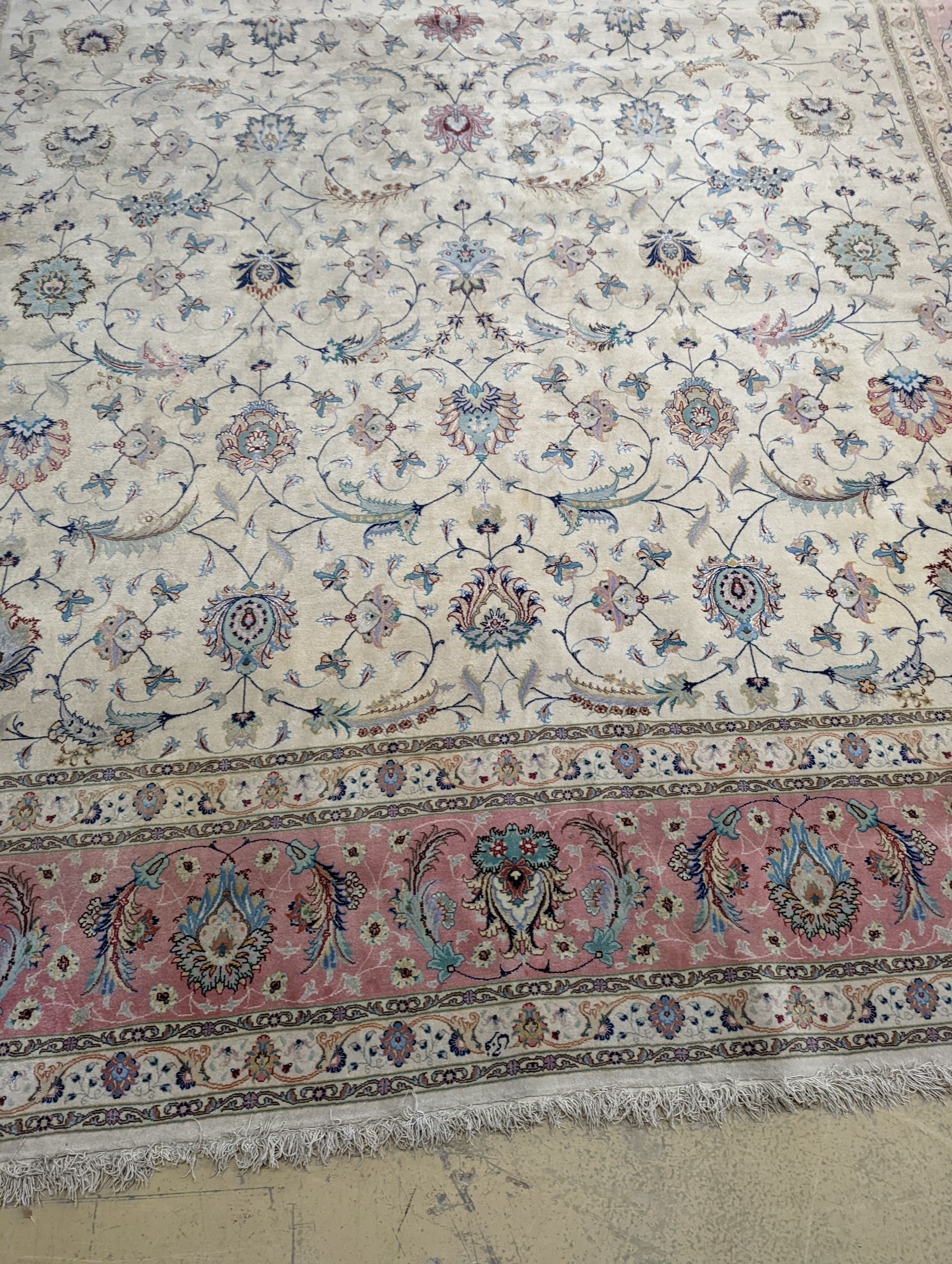 A Persian Tabriz ivory ground carpet, 410 x 300cm